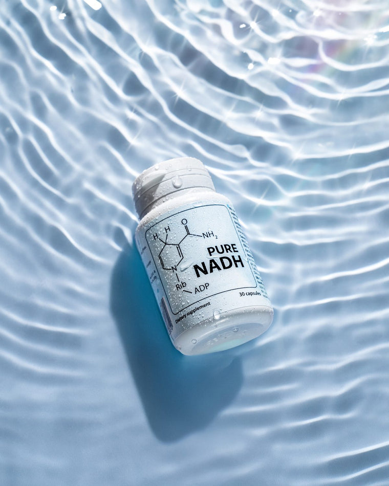 PureNADH bottle lying in clear rippled water